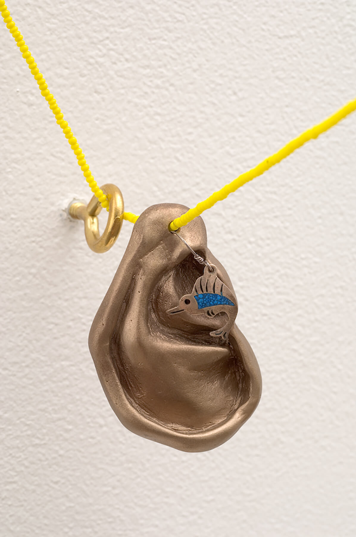 Right here, Bronze, earring, beads, fishing line, Life size, 2008